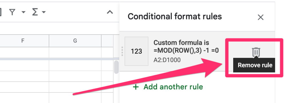 The arrow on the screenshot is pointing to the remove rule trash icon which allows to remove conditional formatting rules