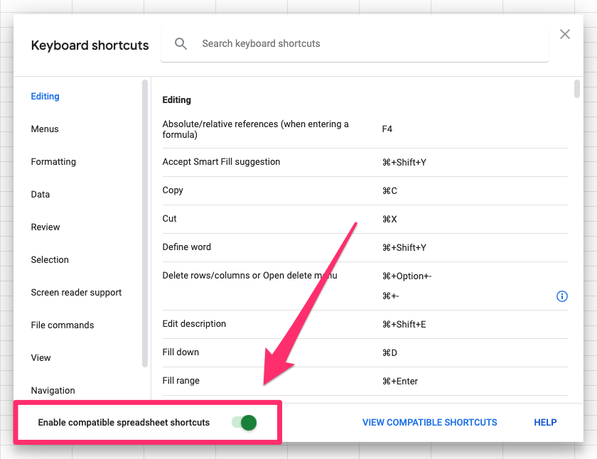 The arrow shows where to find the 'enable compatible spreadsheet shortcuts' toggle in the dialog box. It's in the bottom-left corner of the popup